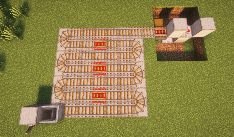 Rail collection system with powered rails and redstone blocks for hopper minecart